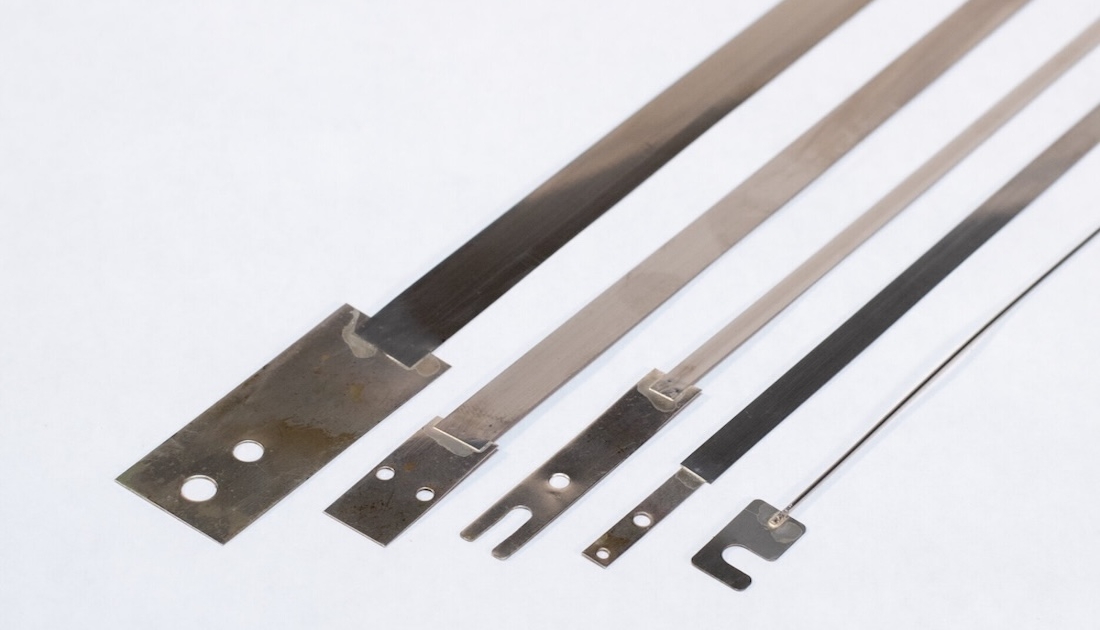 Nichrome heating elements for impulse heat sealers with terminal tabs